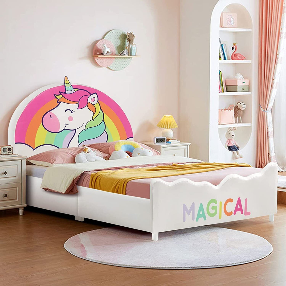 Kids' twin size white platform bed with a colorful unicorn pattern on the headboard, placed in a room with various children's toys and a bookshelf in the background.