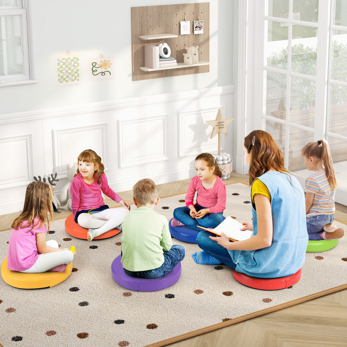 Children sitting on colorful cushions in a classroom setting