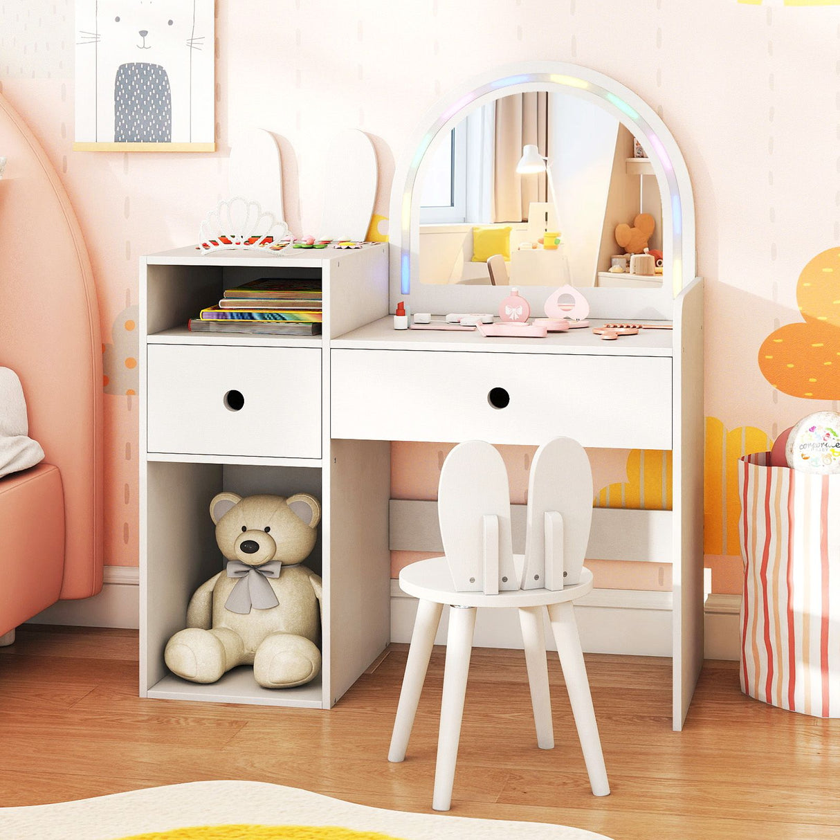 Children's room with a vanity table, chair, and teddy bear.