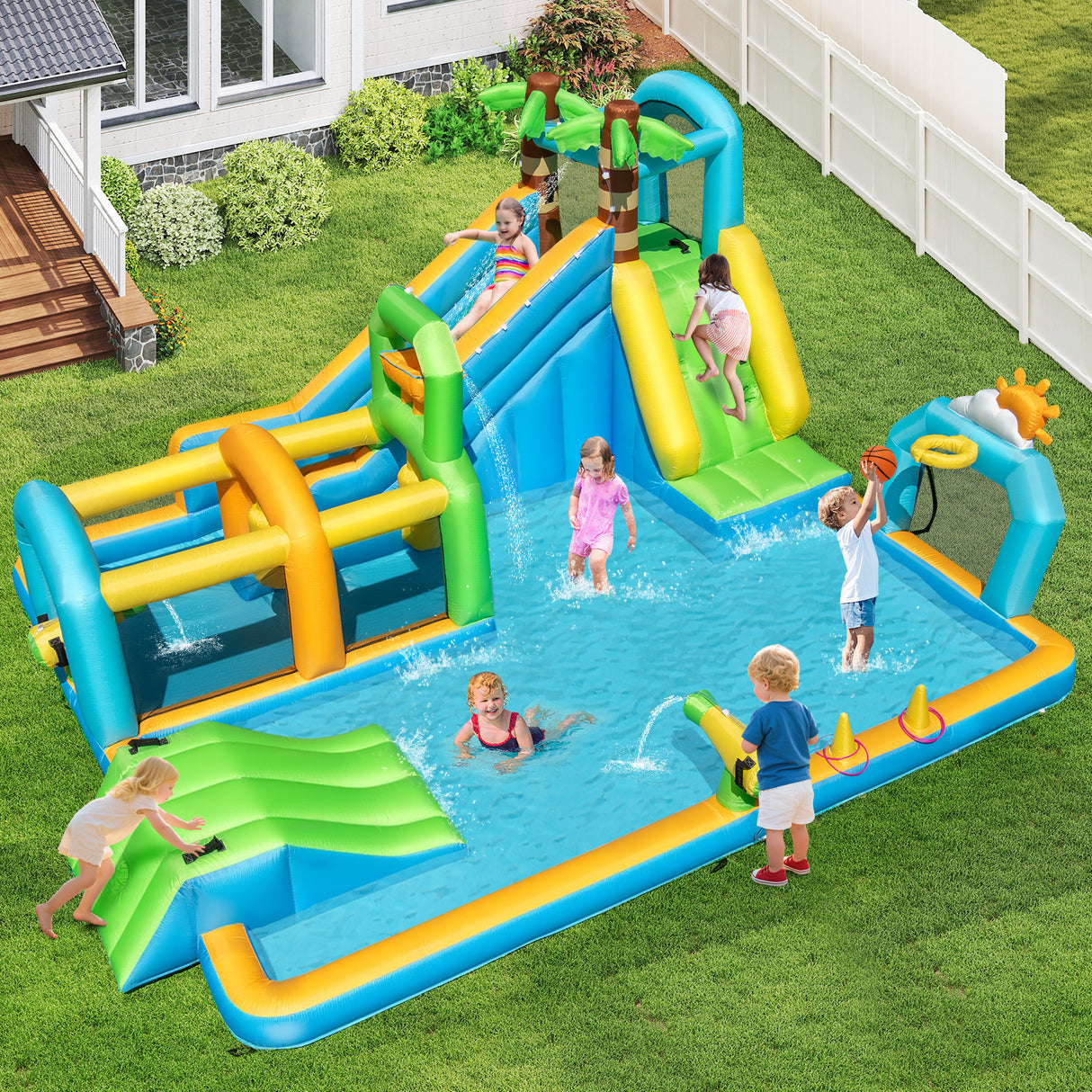 Children playing on an inflatable water slide and pool in a backyard.