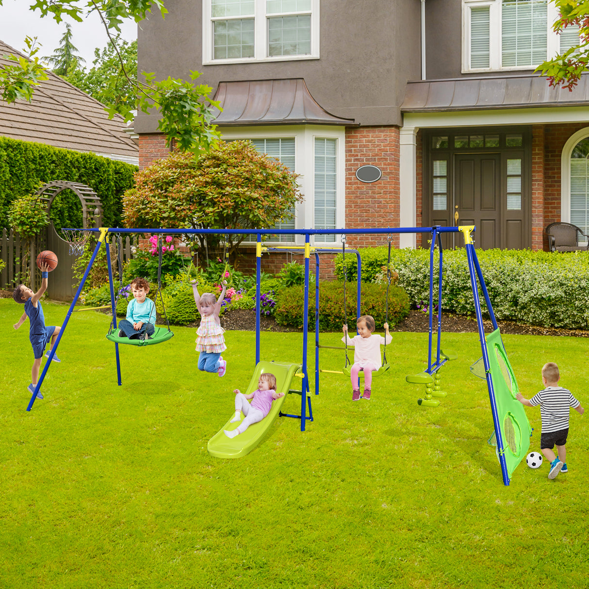 Children playing on a playground set in front of a house