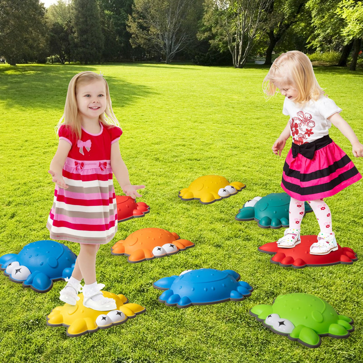 Two children playing with colorful turtle-shaped stepping stones on a grassy area.
