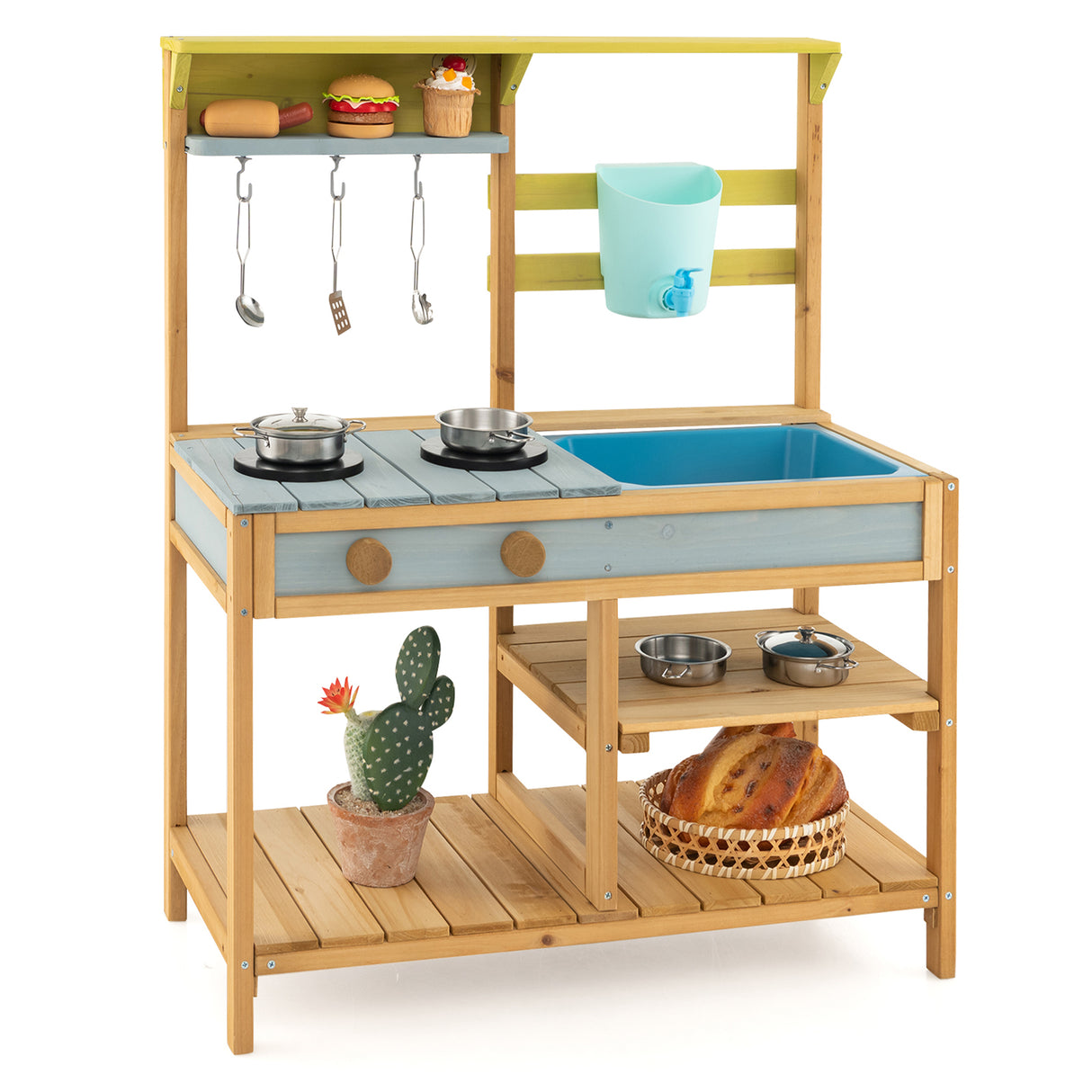 Wooden play kitchen set with toy food items on a white background