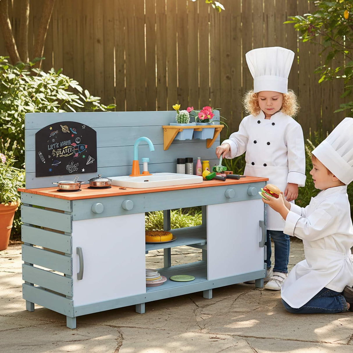 Children playing with a toy kitchen set outdoors
