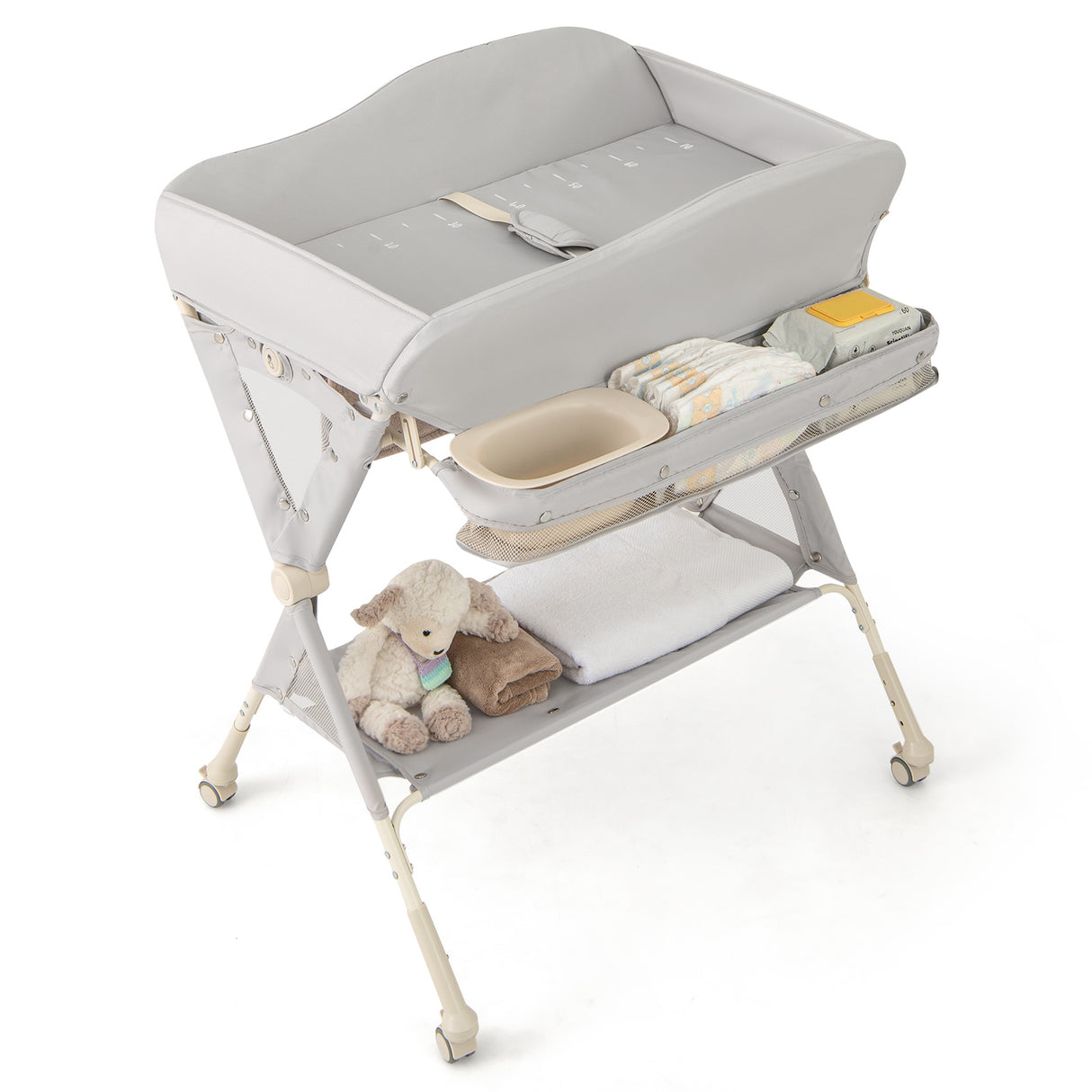 Grey baby changing table with a teddy bear on a white background