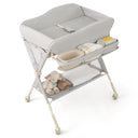 Grey baby changing table with a teddy bear on a white background