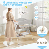Baby changing table with wheels in a room setting, featuring text and icons about wheel features.
