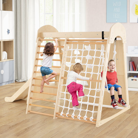 Children playing on a wooden climbing frame in a room with toys and books.