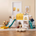 Toddlers playing on a multifunctional L-shaped plastic slide that includes a telescope, climber, slide, tunnel, basketball hoop, and storage area. The slide is white and pink with children wearing casual clothing.