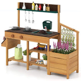 Wooden outdoor kitchen set with pots, tools, and plants on a white background