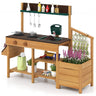 Wooden outdoor kitchen set with pots, tools, and plants on a white background