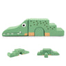 Green crocodile-shaped building block set on a white background