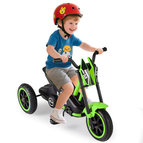 Child riding a green and black tricycle with a helmet on a white background