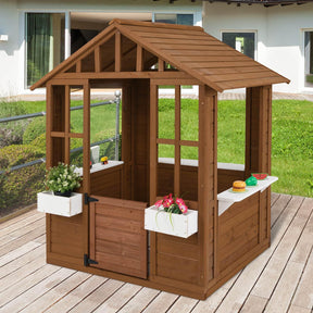 Wooden playhouse with decorative elements on a wooden deck