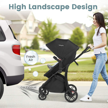 Woman pushing a black stroller with a car and landscape design feature highlighted.