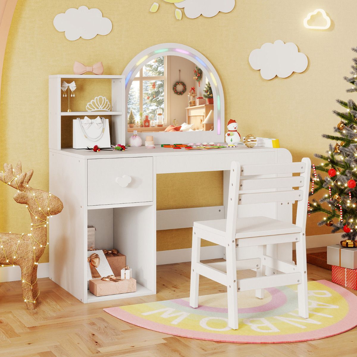 Children's vanity table with mirror, chair, and Christmas decorations in a room.