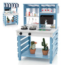 A 2-in-1 double-sided kids' wooden kitchen playset with a canopy, featuring a cooking area on one side and a dining/ordering area on the other, decorated with potted plants and kitchen accessories.